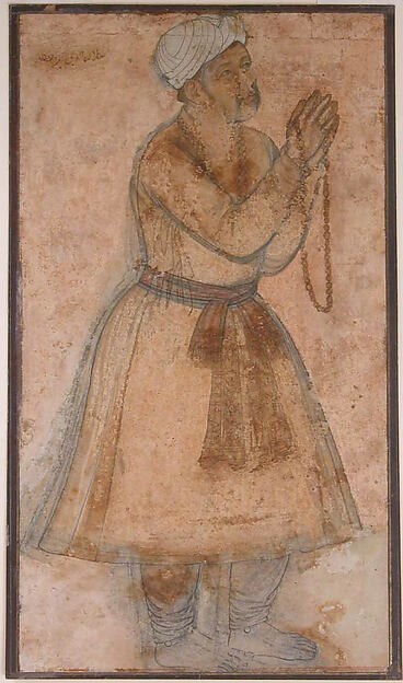 Profile portrait of the elderly Akbar raising his hands while holding prayer beads.