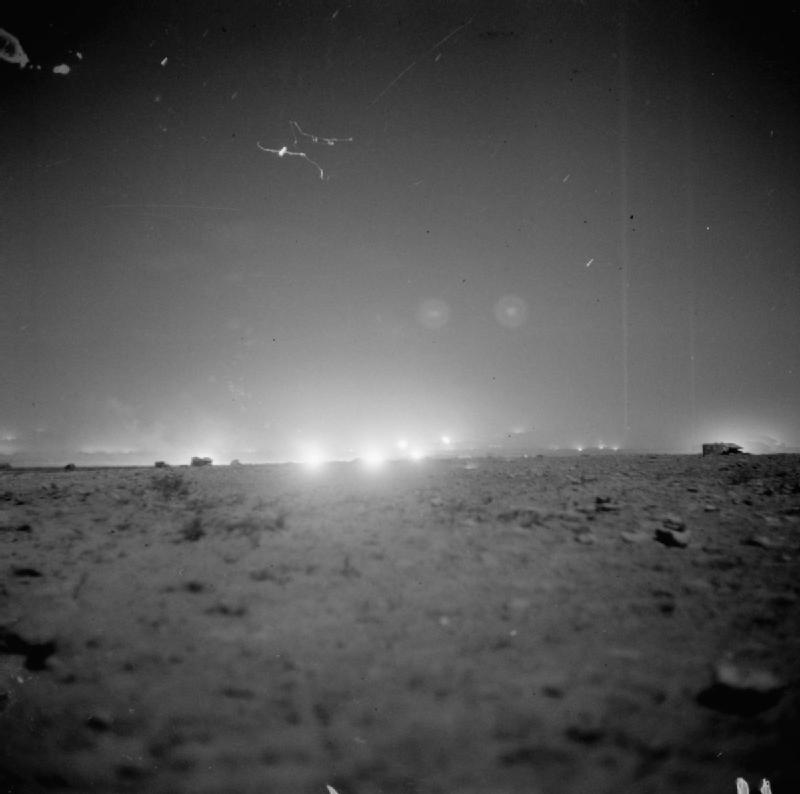 Vehicles silhouetted against the opening night artillery barrage at El Alamein, 23 October 1942