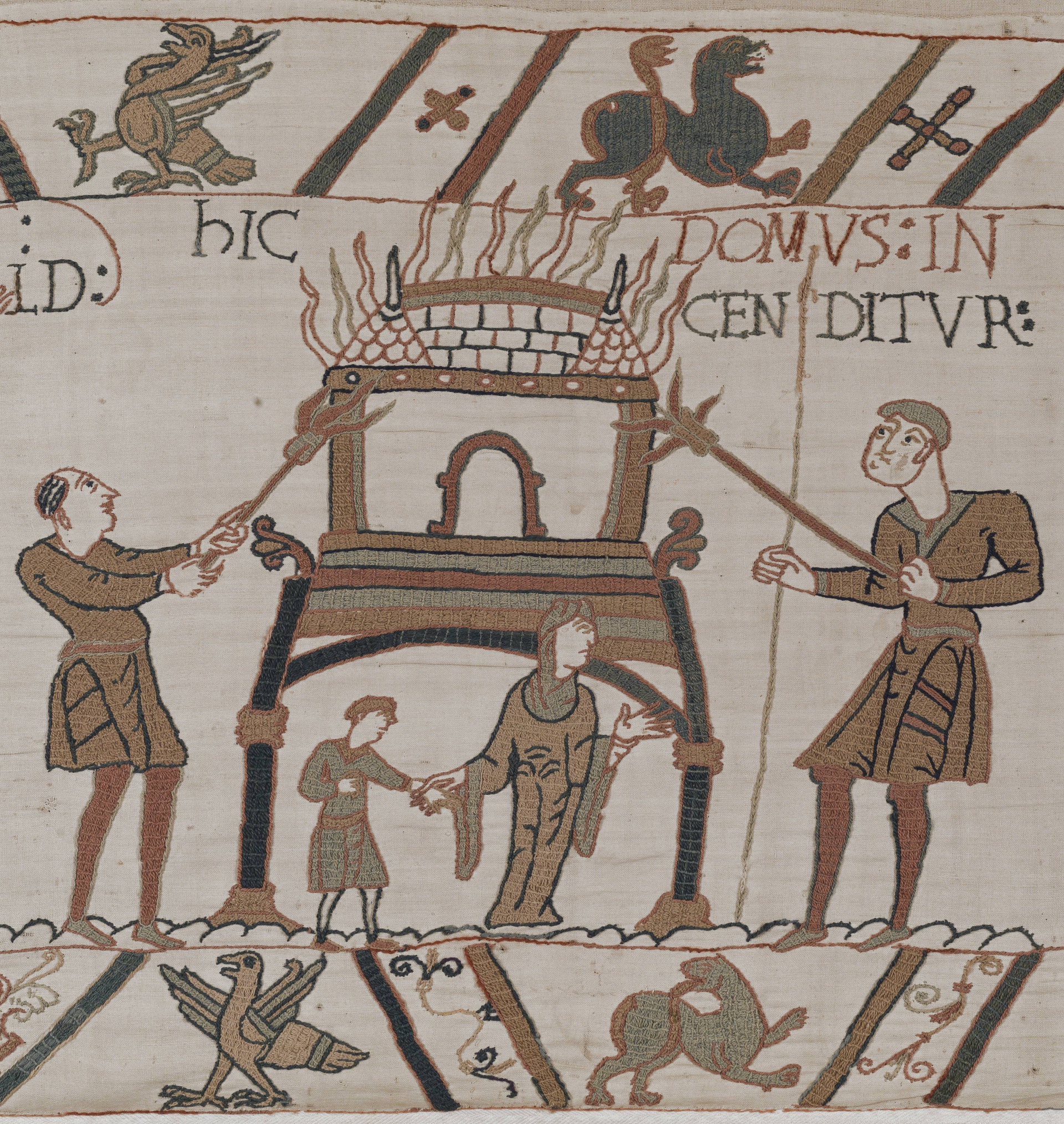 Two men setting fire to a house, with a woman and child below it.
