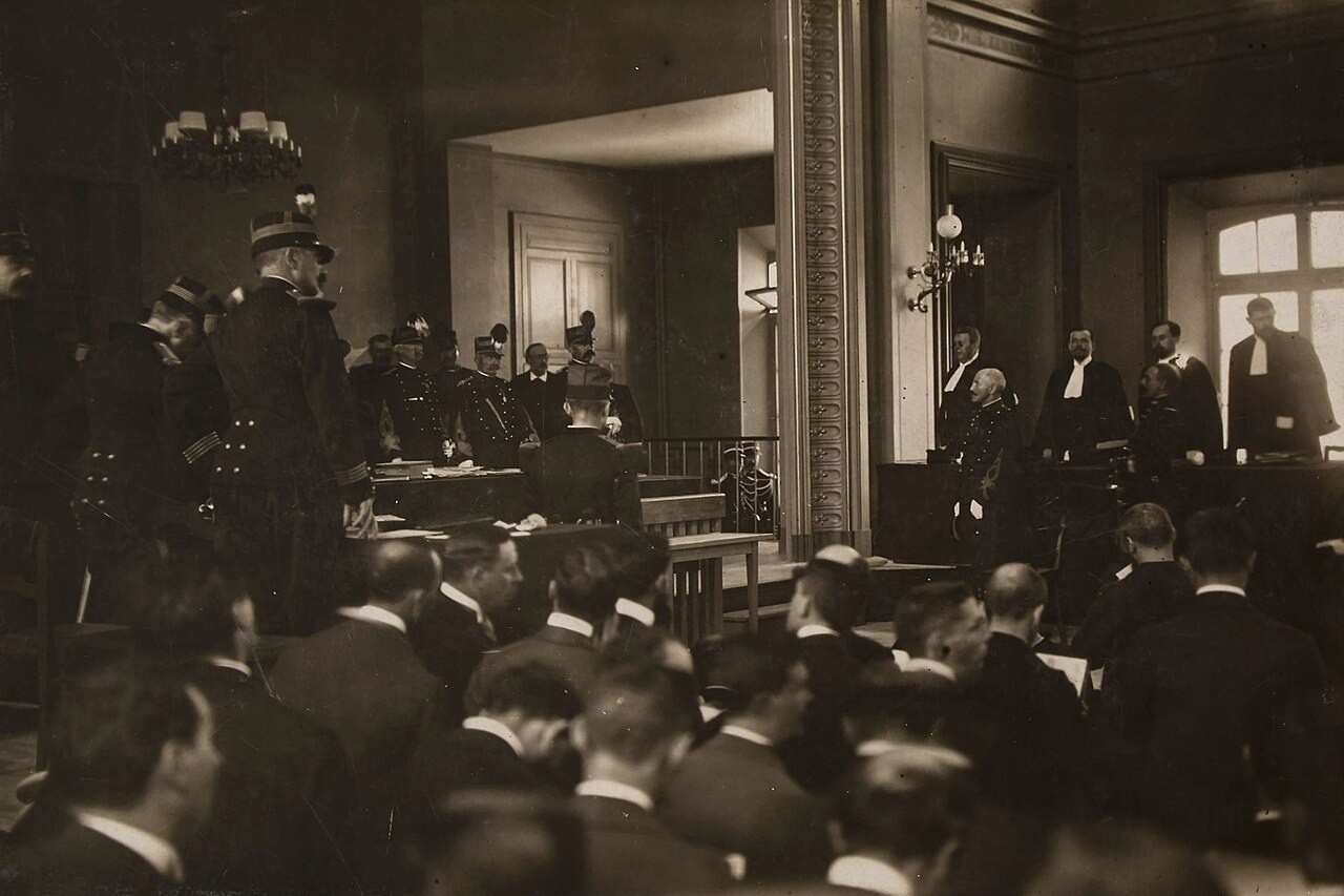 Dreyfus and military officers seated in the courtroom at the Rennes retrial