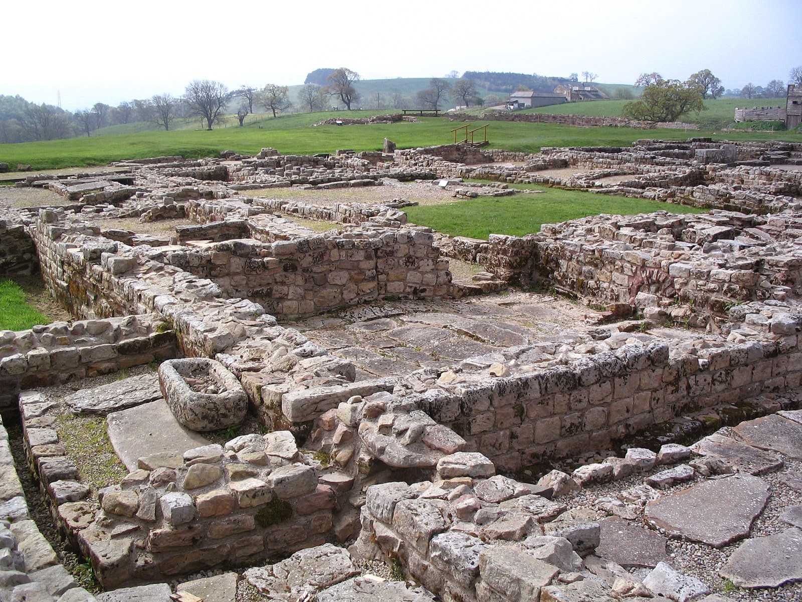 Excavated stone foundations and paths at the Roman site of Vindolanda