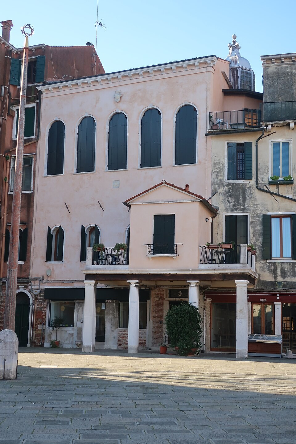 The Scuola Italiana in Venice, showing five arched upper windows above an entrance portico.