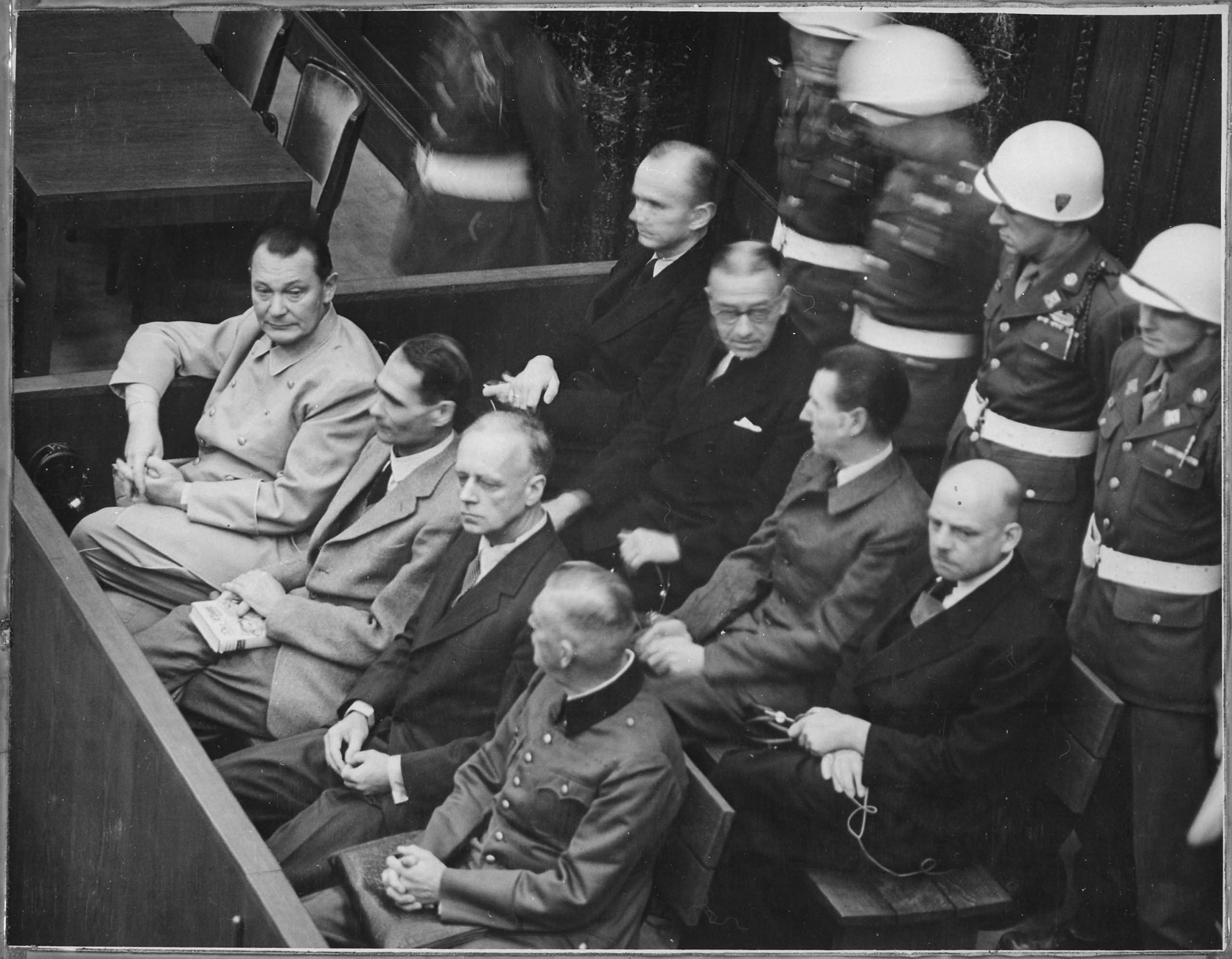 Defendants sit in the dock under military guard at the International Military Tribunal in Nuremberg.