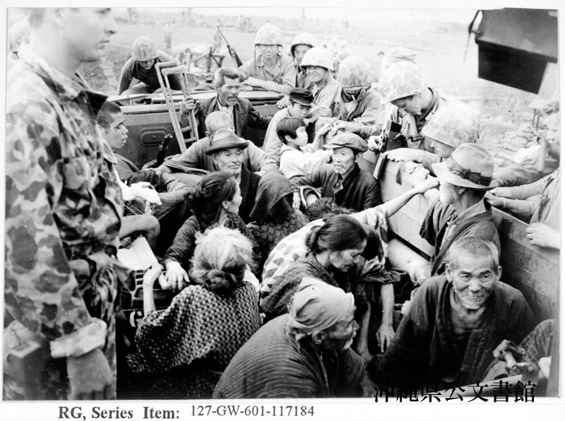 Okinawan civilians from Sobe riding in a U.S. amphibious truck on 2 April 1945