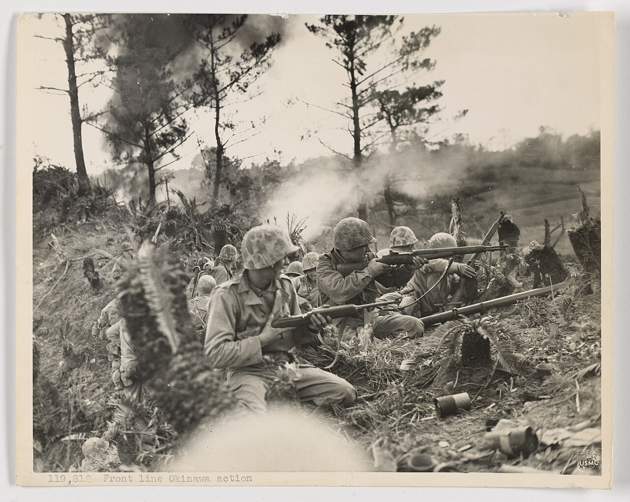 U.S. Marines taking cover on a ridge north of Naha, Okinawa, in May 1945