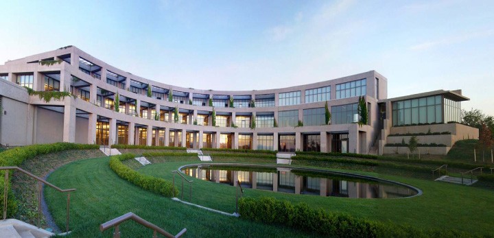Exterior of the Library of Congress Packard Campus, with curved buildings and landscaped grounds.