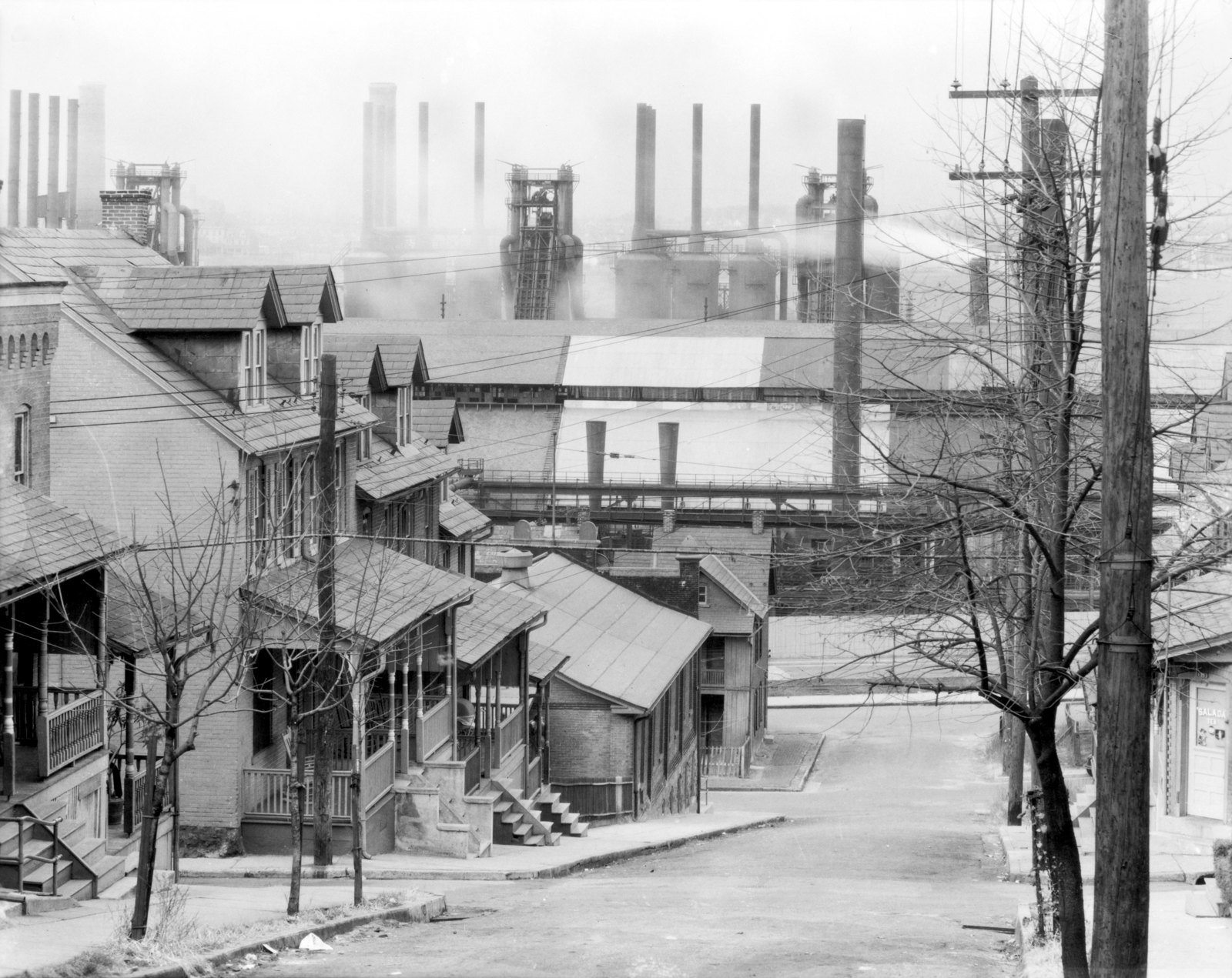 A hillside cemetery and houses overlook steelworks in Bethlehem in 1935.