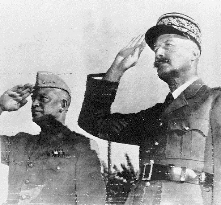 Dwight Eisenhower at left and Henri Giraud at right salute at Allied headquarters in Algiers in 1943