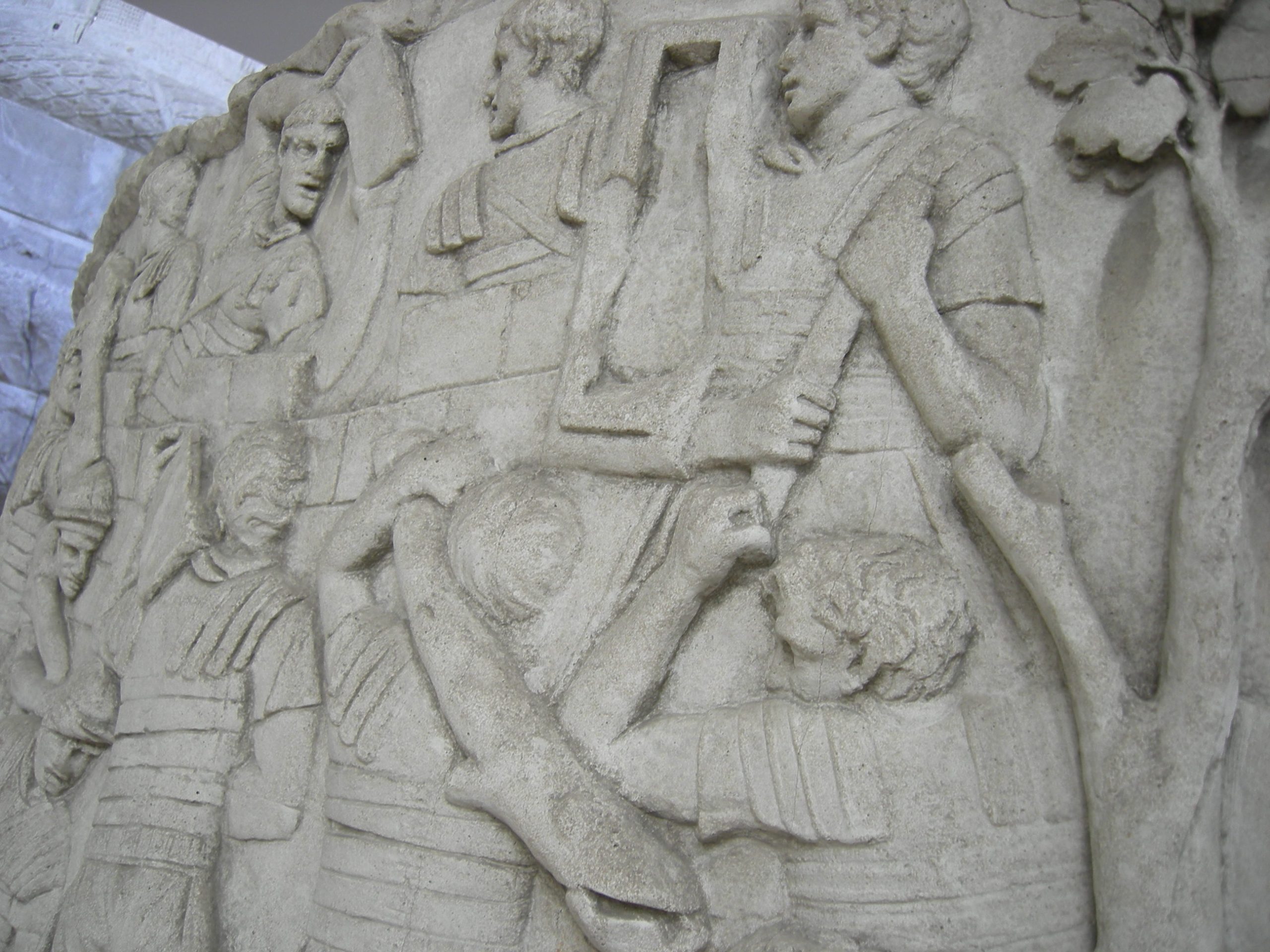 Plaster cast of a relief showing Roman soldiers carrying stone and building a fortress wall