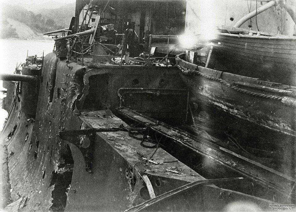 Historical photograph of shattered structures and damage aboard the battleship Orel