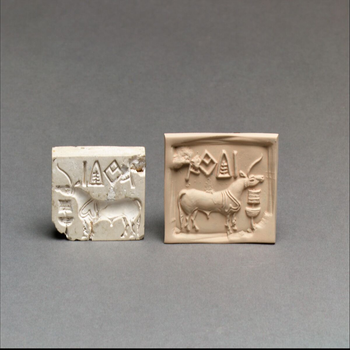 Square pale stone seal beside a modern tan impression showing a one-horned animal and a line of signs.